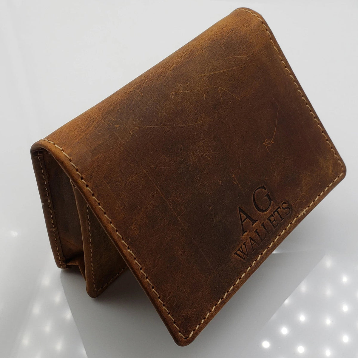 Custom leather corporate holiday gift wallet with embossed logo